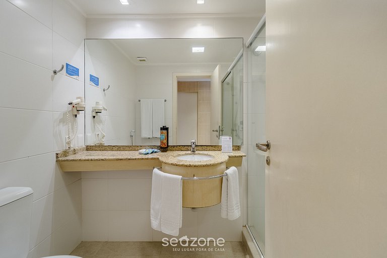 Suíte com bela vista mar/piscina Jurerê JBV248