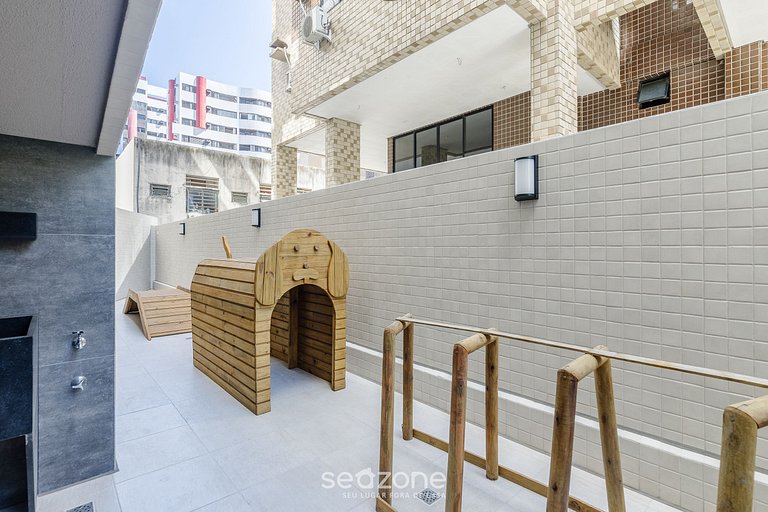 Estadia com piscina e academia a 350m da Praia em localizaçã