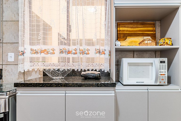 Pie apto en la arena con vista al mar en Meia Praia EVB308