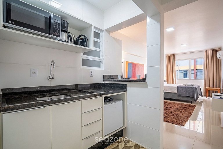 Studio em prédio no Centro c/ Vista DIL0103