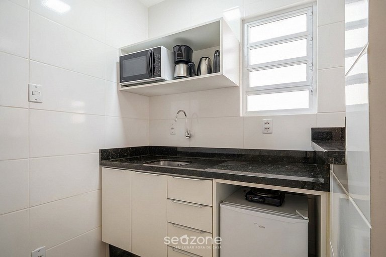 Studio em prédio no Centro c/ Vista DIL0103